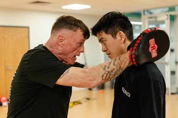 Head Coach Joe Lake training a boxer